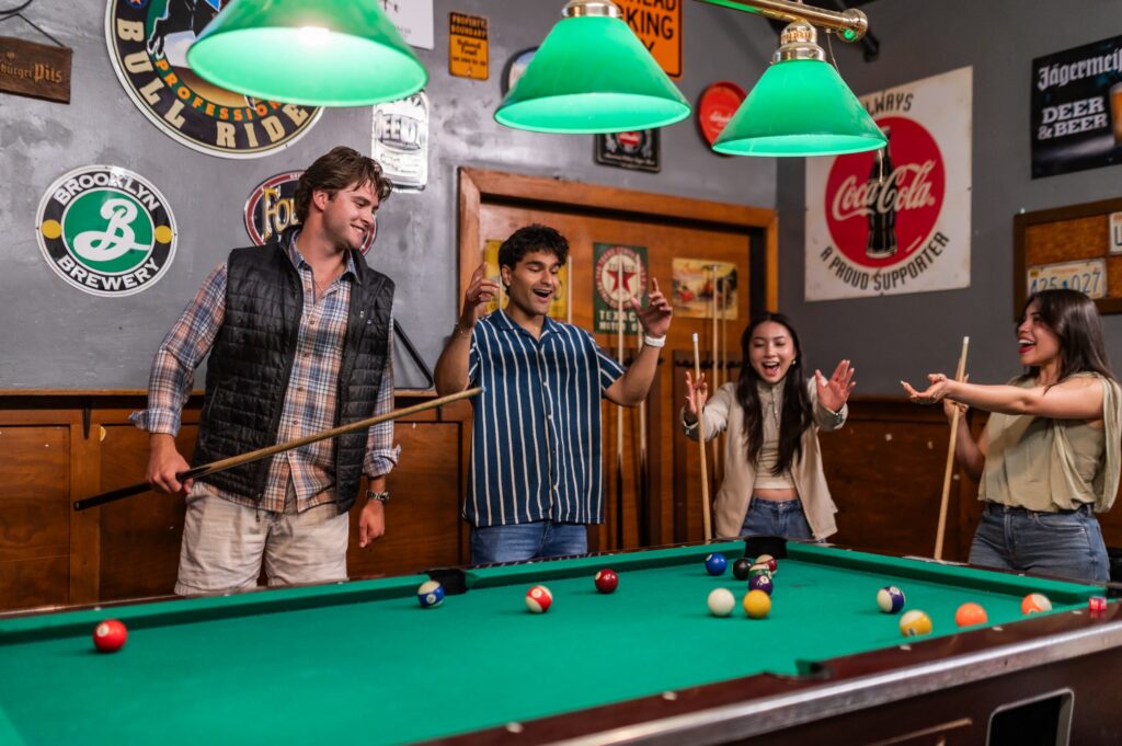 Friends shooting pool at a classic bar near the Virginia Tech campus