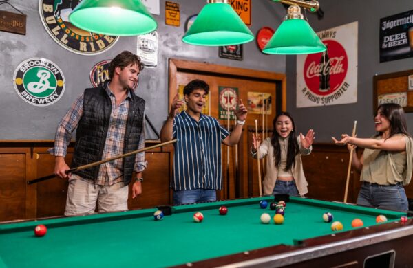 Friends shooting pool at a classic bar near the Virginia Tech campus