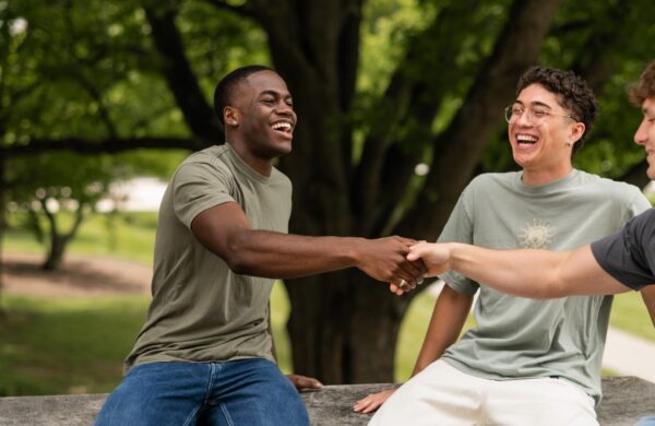 Friends taking a break on a bench on the Virginia Tech campus