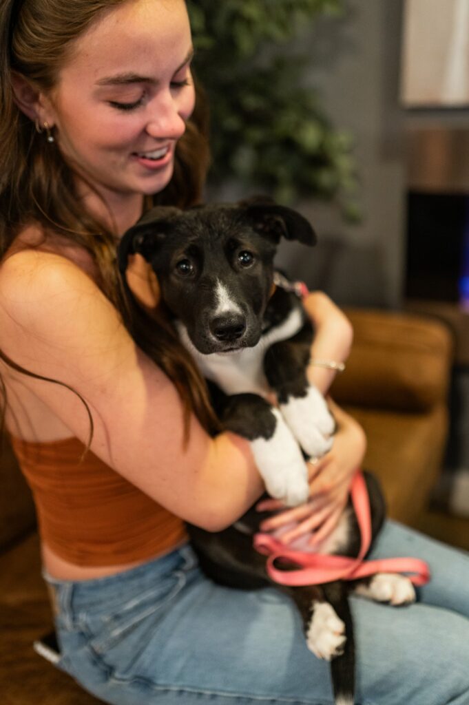 Girl holding her dog at their pet friendly student community