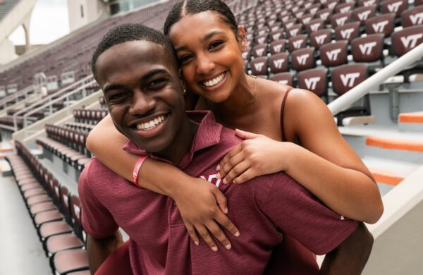 Two friends posing for a photo at Lane Stadium