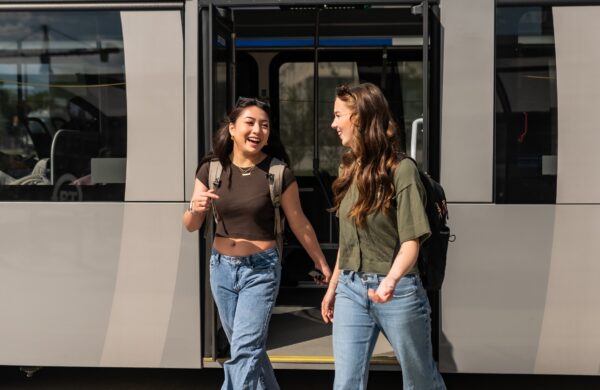 Two girls getting off the Blacksburg Transit bus