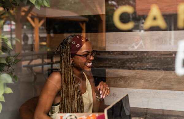 Young woman studying in a coffee shop near Heyday Blacksburg